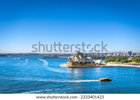 A busy morning around the Sydney Opera House,the transportation boat are cruising in front of the famous Sydney landmark Royalty-Free Stock Photo #2333401423