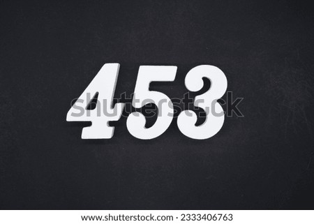 Black for the background. The number 453 is made of white painted wood.