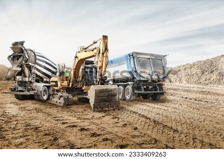 Modern construction machinery at a construction site in a quarry. Powerful modern equipment for earthworks. Rental of construction equipment. Excavator, dump truck, bulldozer, loader Royalty-Free Stock Photo #2333409263