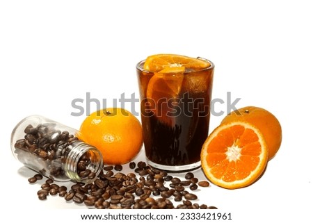 Americano ice coffee served with orange juice slices and coffee beans spread on white background with concept isolated picture.