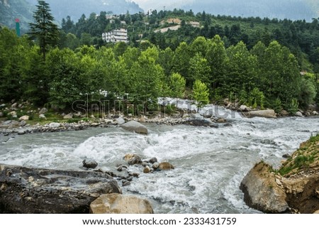 Beas river in Manali flooded during Monsoons Royalty-Free Stock Photo #2333431759