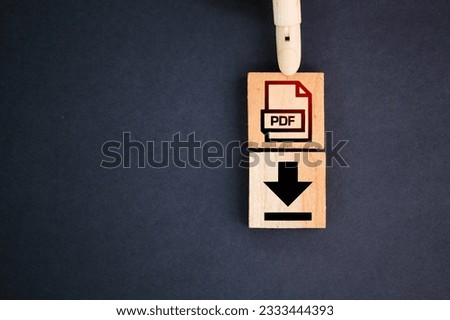 wooden square with PDF format file icon and download. the concept of saving a pdf file. concept pdf file save format