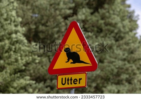 Solleron, Sweden  A road sign saying danger for otters Royalty-Free Stock Photo #2333457723