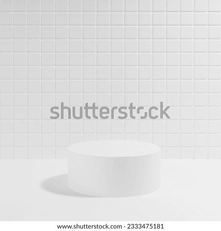 White abstract stage mockup with one cylinder podium in hard light, shadow, template for presentation cosmetic products, spa, goods, advertising, display, tiny mosaic tile in exquisite beauty style. Royalty-Free Stock Photo #2333475181