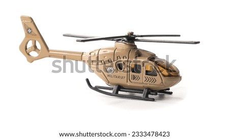 Brown plastic toy helicopter isolated on white background. High quality photo