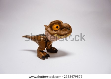 Cute T Rex dinosaurs toy isolated on white background. Isolate, free space, close-up.