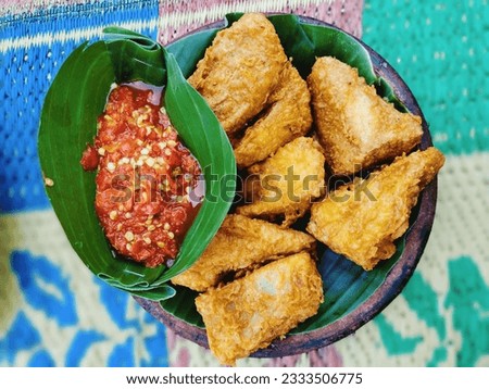 photo of fried tofu meatballs and red chili sauce