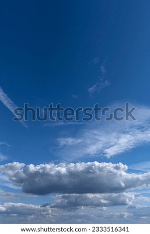 Rain cloud (Nimbostratus) in the blue sky, Bavaria, Germany