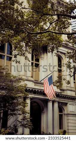 American flag on an old historical building (Old City Hall) of Boston