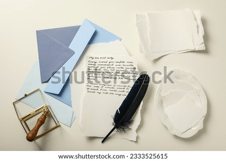 Blue envelopes, sheets of paper, bird feather and letter with text on white background, top view