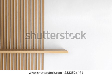 Empty wooden wall shelf on white background. Royalty-Free Stock Photo #2333526491