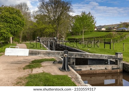 Lower Llangynidr Locks and Bridge 132 on the Monmouthshire and Brecon Canal in the Brecon Beacons National Park. Royalty-Free Stock Photo #2333559317