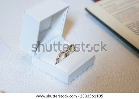 Romantic marriage couple wedding Symbols rings in a white box on a table