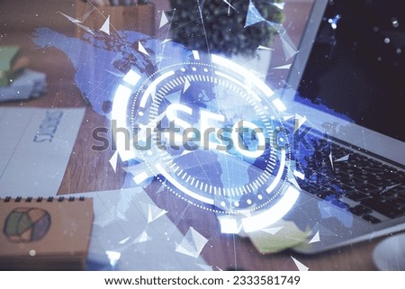 Multi exposure of table with computer and seo drawing hologram. Search optimization concept.