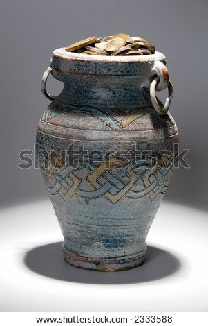 coins in a ancient pot