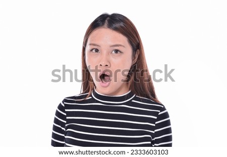 young girl standing wearing white-black striped dress with open mouth  on white background 