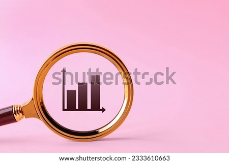 Graph on pink background, space for text. View through magnifying glass