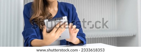 Portrait of woman relax use digital network tablet.Young girl looking at screen typing message and playing game online or social media at cafe, technology, shopping, business, online banking, payment