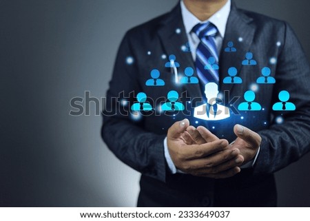 Businessman holding staff icon in arms HR managers selecting candidates find the right person for right job. Human resource management and human development for organization. recruitment concept.