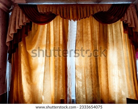 Beautiful curtain on the window and transparent tulle curtain. Abstract background, texture and pattern. Space for text and copy space