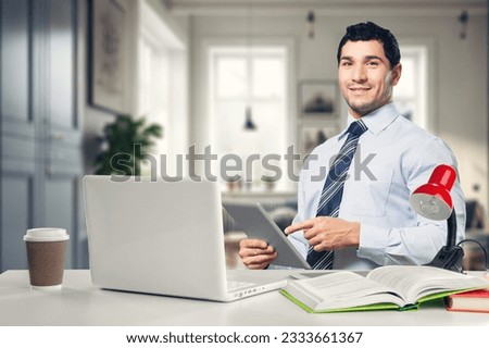 Young modern happy business man at work
