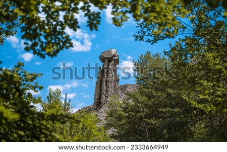 Aerial photography by drone of the rock formations, the Demoiselles Coiffées in Serre-Ponçon and its mountains, located in the Hautes-Alpes in France