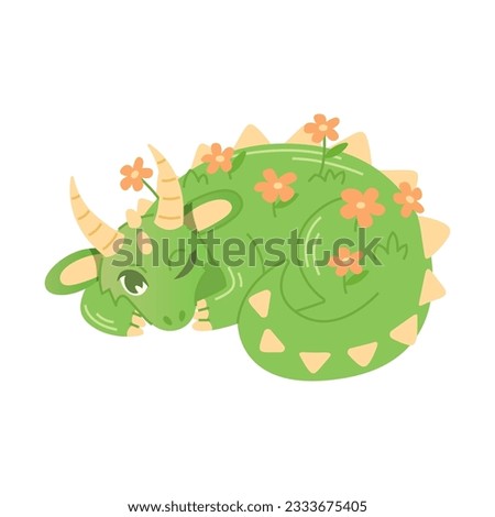 Large green dragon, covered with flowers, lies with one eye open.