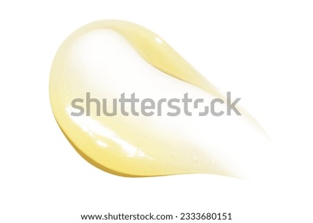 Smear of yellow cream, balm, conditioner with banana, egg or chamomile on an empty background. Isolated. Royalty-Free Stock Photo #2333680151