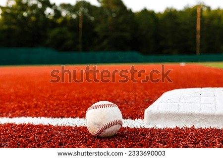 Baseball background with image of field, baseband baseball on artificial turf.