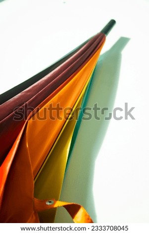 Abstract shot of the beautiful colorful umbrella on white background. 
