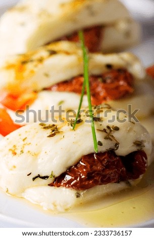 cypriot halloumi cheese baked with garlic,herbs,sundried tomatos and red pepper