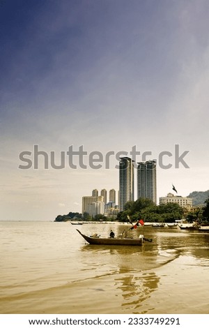 Cityscape of ship on the sea near the port.