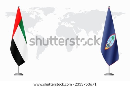 United Arab Emirates and Guam flags for official meeting against background of world map.