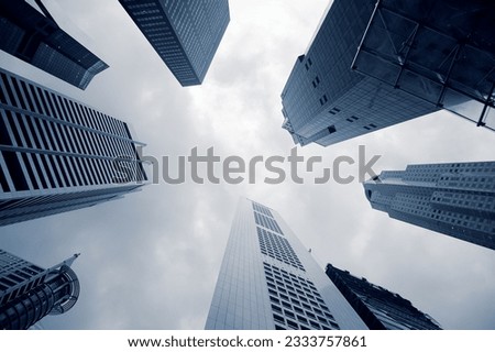 Business buildings background with skyscrapers under sky.