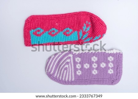 winter knitted socks.
Wool knit booties decorated with Anatolian motifs Royalty-Free Stock Photo #2333767349