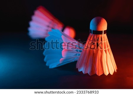badminton shuttlecock on court in vibrant lighting decoration for competitive high performance indoors rackets sports game tournament match equipments for advertising graphics image