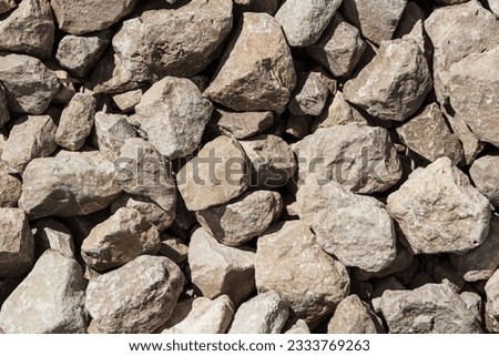 Granite stone chips background close-up. Crushed stone texture. Royalty-Free Stock Photo #2333769263