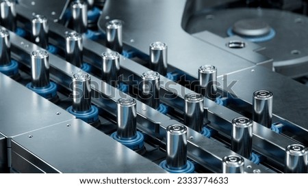 Close-up of Battery Cells for Automotive Industry on Production Line. High Capacity Battery Manufacturing Process. Lithium-ion Cells for High-voltage Electric Vehicle Batteries on Conveyor. Royalty-Free Stock Photo #2333774633
