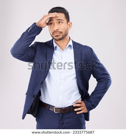 Business man, stress and confused in studio for anxiety, debt and stock market crash for fail economy. Asian male worker thinking of bankruptcy problem, doubt and financial crisis on white background Royalty-Free Stock Photo #2333775687