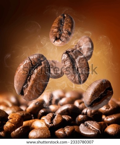 Grains of roasted coffee on an orange background