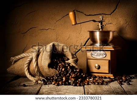 Coffee grains and mill in cellar with clay wall