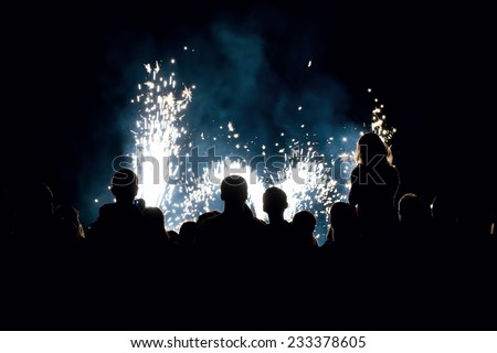 Image of a people in front of a fireworks