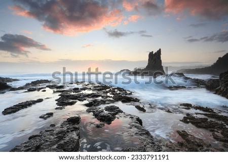 Beautiful rock formations one in the resemblance of a cathedral, and aptly named Cathedral Rock on the south coast near Kiama, Australia, a great place to travel or visit. Sunrise