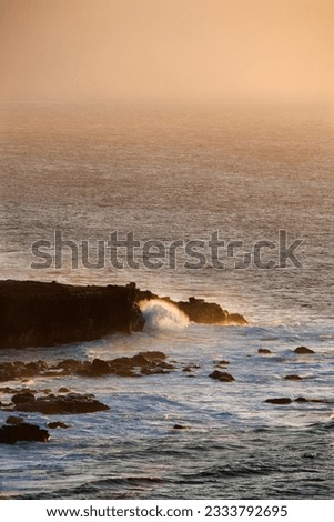 Waves on rocky shore in Maui, Hawaii.