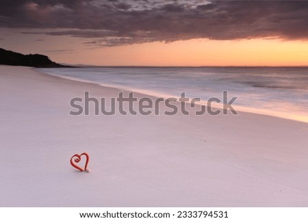 Love Jervis Bay, Australia, Soft hues of dawn and a lone red heart in the sand at the beautiful beaches of Jervis Bay