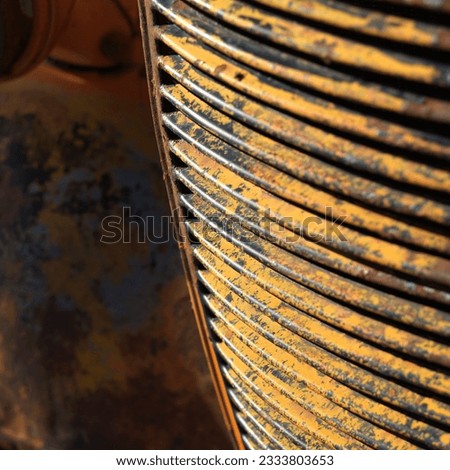 Close-up of radiator grill of rusty old pick-up truck.