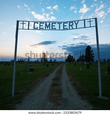Sign over entrance to cemetary at dusk in rural South Dakota.