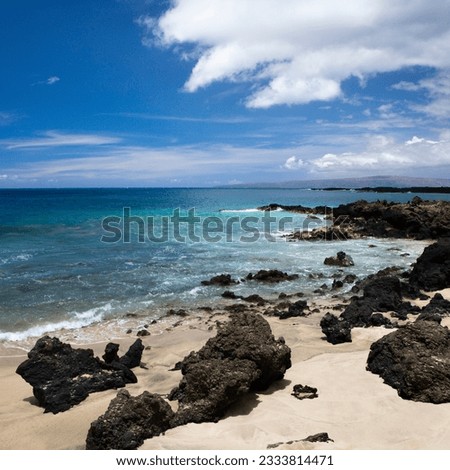 Beach in Maui, Hawaii with lava rocks.