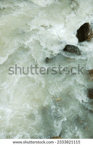River rapid shot taken with fast shutter speed- vertical orientation