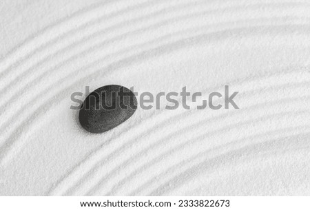 Zen Garden with Grey stone on White Sand Wave Pattern in Japanese stye, Rock Sea Stone on Sand texture with the wave parallel lines pattern,Harmony,Meditation,Zen like concept	